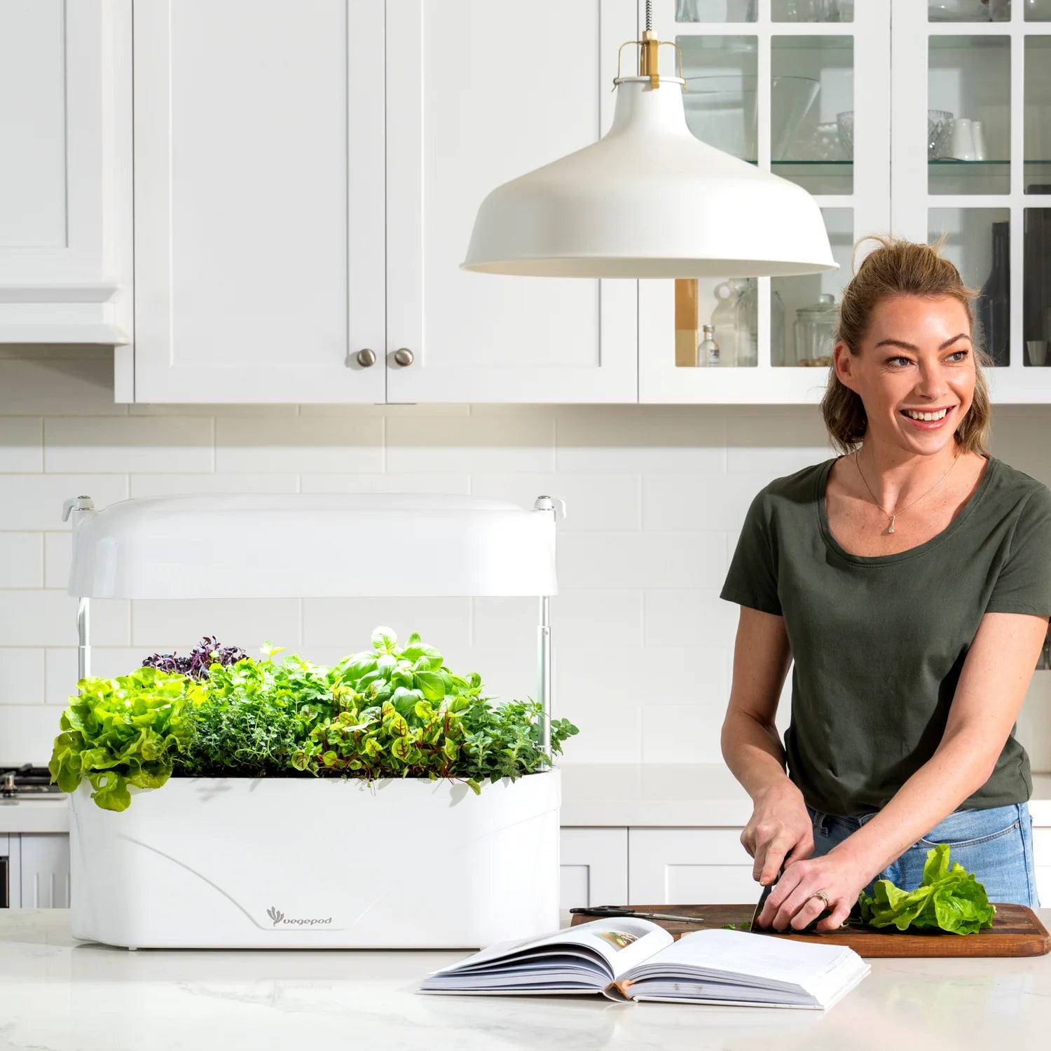 lady with her Vegepod Kitchen Garden White Planters Raised Gardens Australia