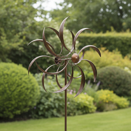 Decorative metal windmill on a white background