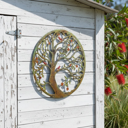 Decorative metal tree wall art with birds and flowers on a white background