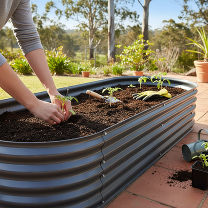 Hands planting in Greenfingers raised bed